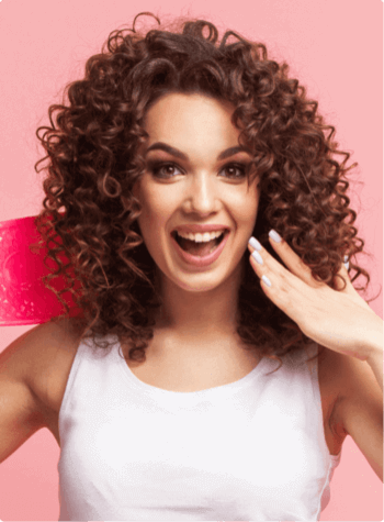 Girl with curly hair smiling