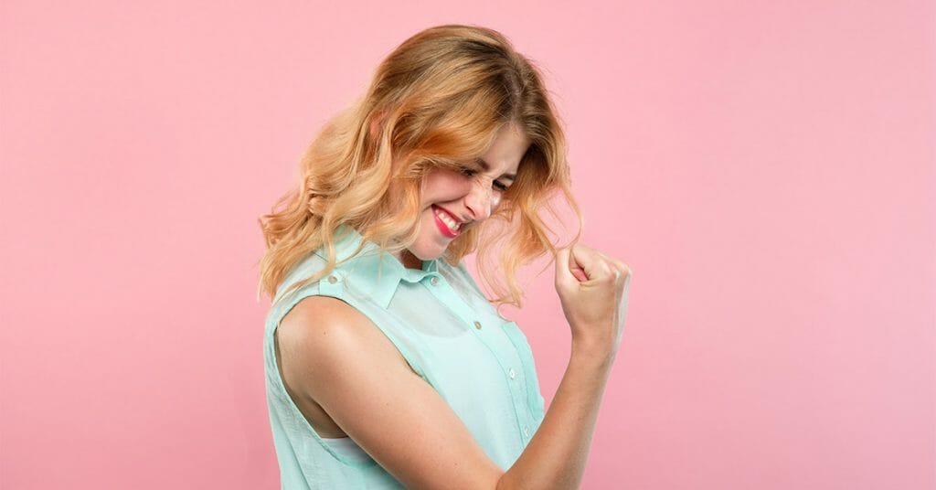 woman cheering after being approved for same day loans bad credit