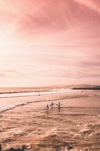 three men going surfing and talking about payday loans no credit check
