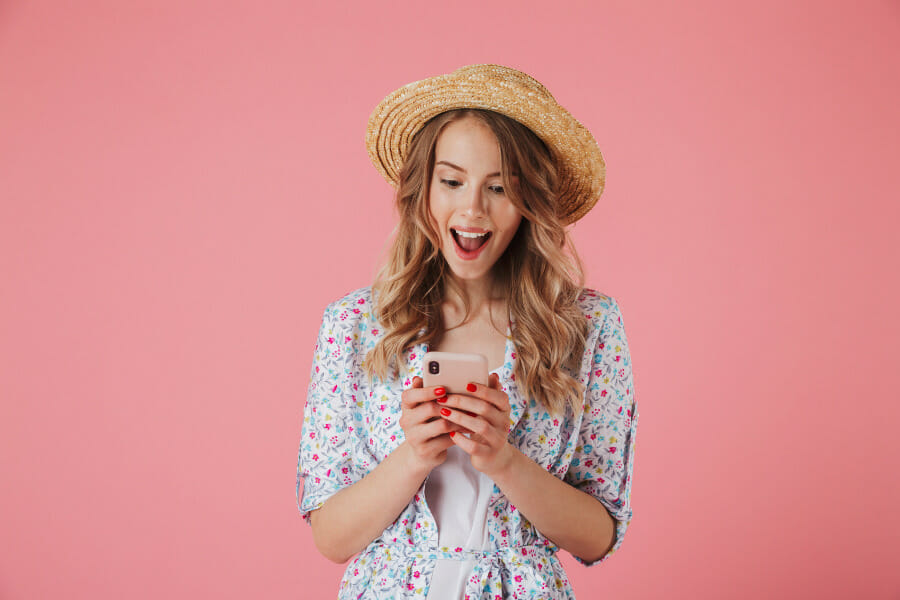 Woman being approved for fast cash loans on iPhone