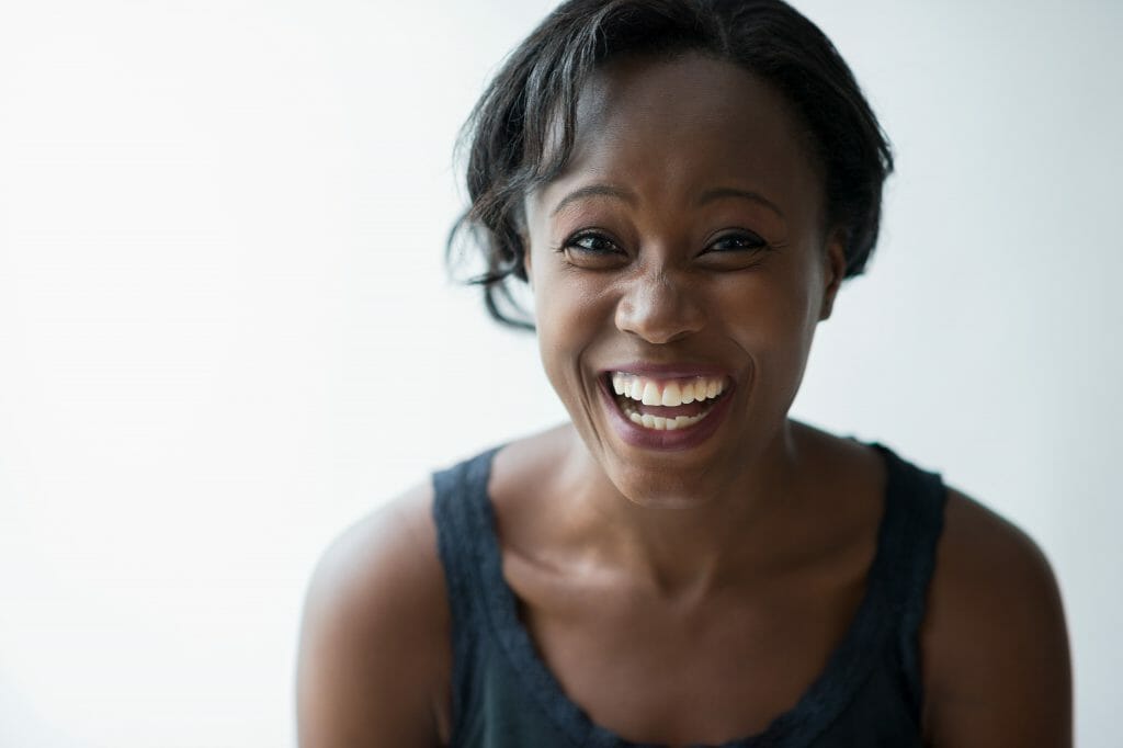 Woman laughing after hearing about easy approval loans