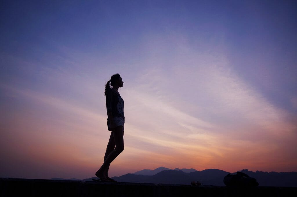 Woman at dusk thinking about same day approval loans