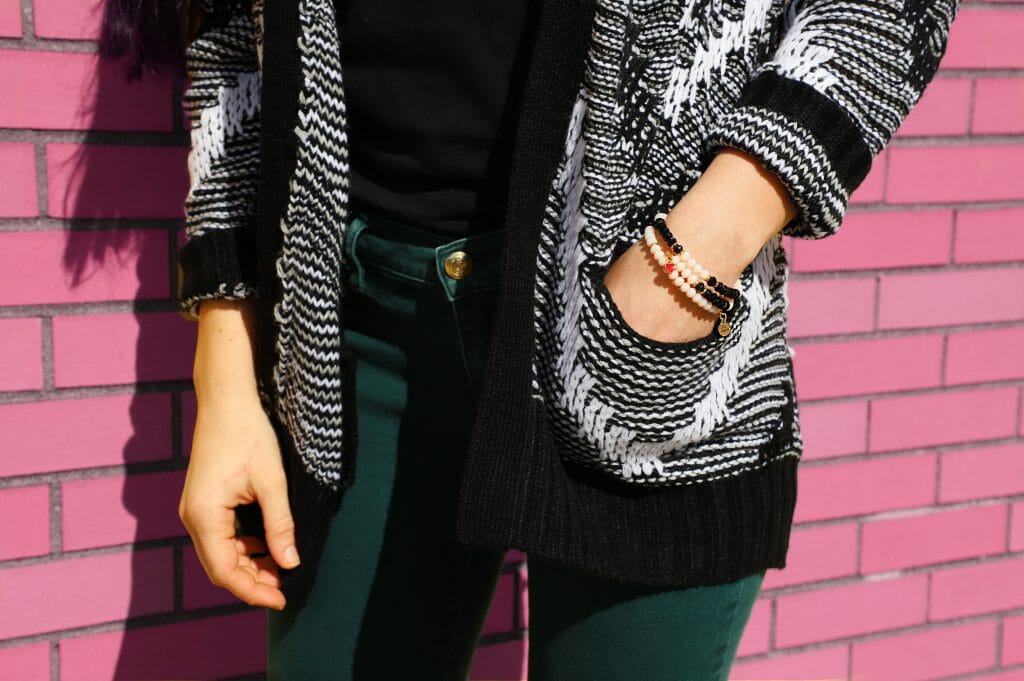 Woman wearing cardigan purchased with unsecured personal loans