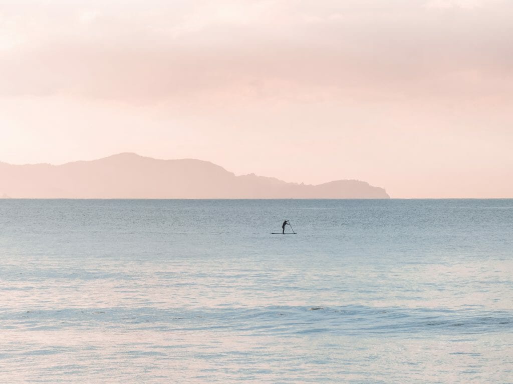 Man on paddle board thinking about quick loans no credit check same day
