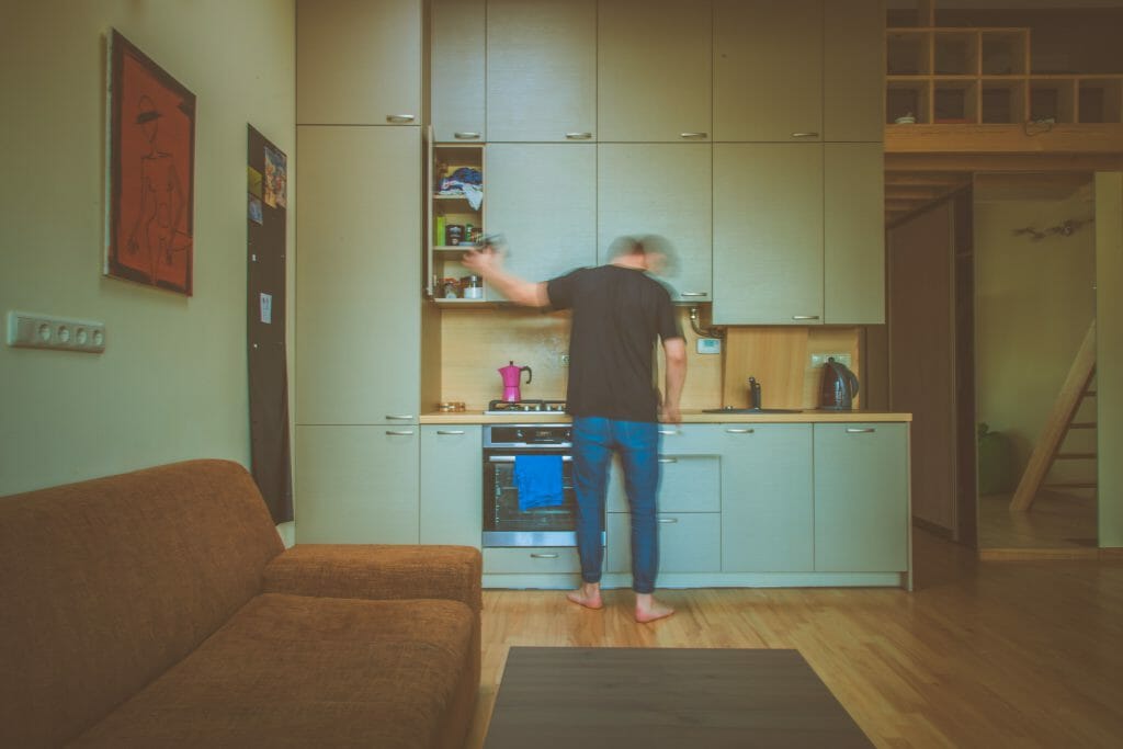 Man standing in front of oven bought with white goods loan