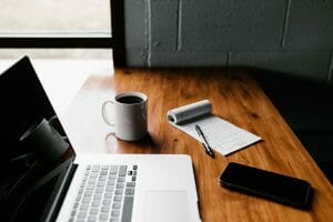 Credit report on desk with coffee and notepad