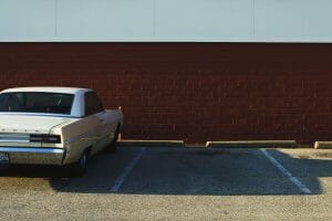 Secured car loan rates vehicle sitting in car park