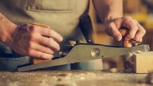 Trade support loan carpenter cutting wood