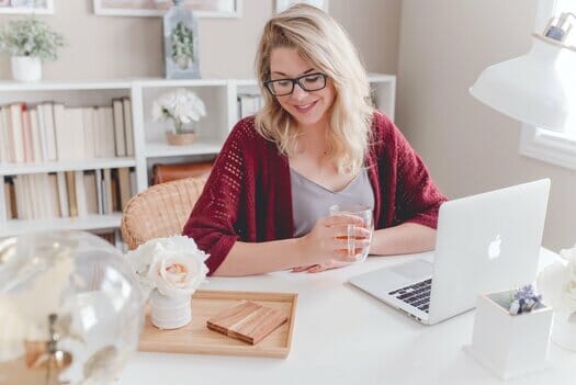 Woman with blonde hair after buying laptops on finance